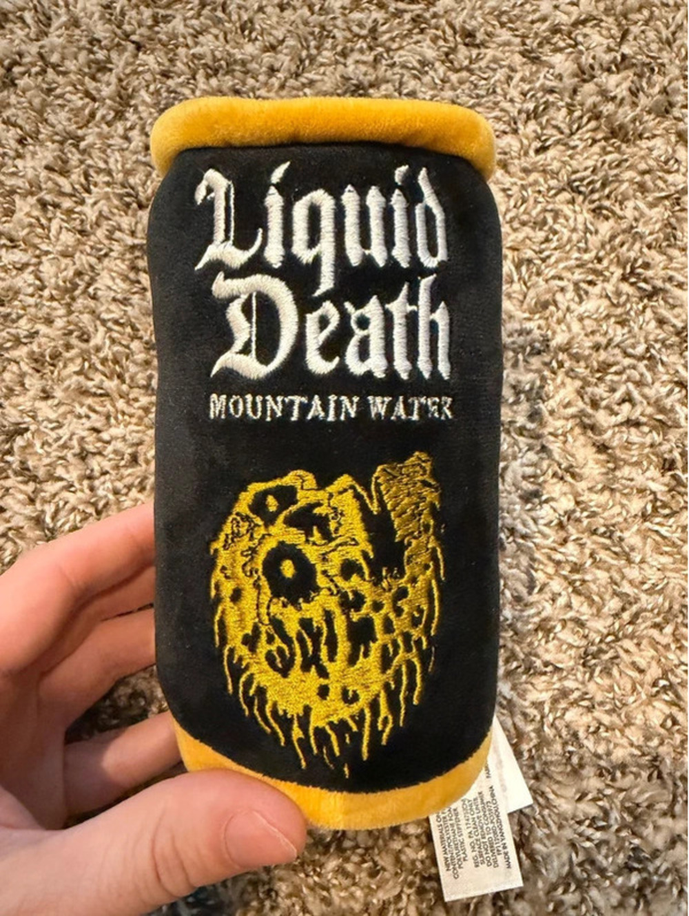 Stuffed liquid death plush bottle black